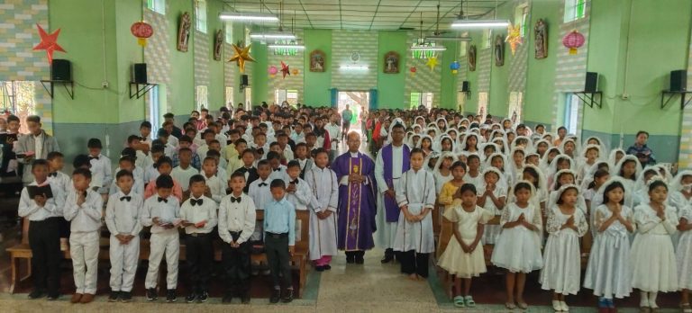 137 Children Receive First Holy Communion at St. Dominic Savio Church, Garobadha